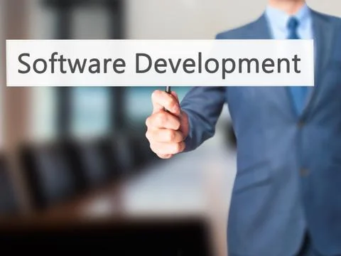 Software Development - Businessman hand holding sign 스톡 사진