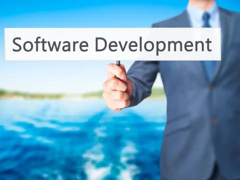 Software Development - Businessman hand holding sign Foto stock