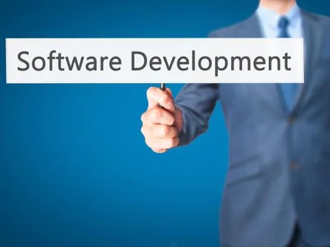 Software Development - Businessman hand holding sign Stock Photos