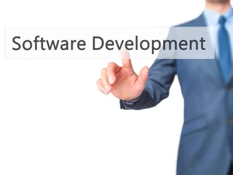 Software Development - Businessman hand pressing button on touch screen inter Stock Photos