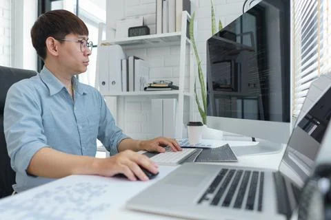 Software development concept, Male programmer typing data code on laptop to d Stock Photos