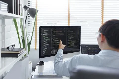 Software development concept, Male programmer checking data codes on document Stock Photos