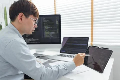 Software development concept, Male programmer point data on tablet to checkin 스톡 사진