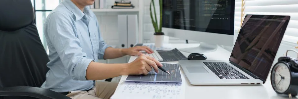 Software development concept, Male programmer pointing on data code to checki Stock-Fotos