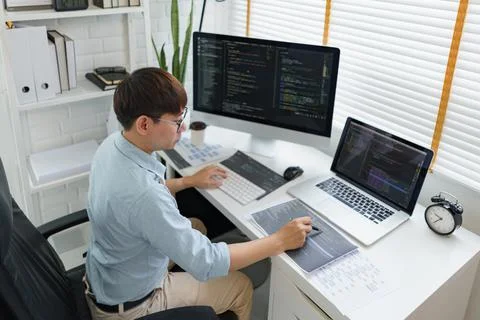 Software development concept, Male programmer pointing on data code to checki 스톡 사진
