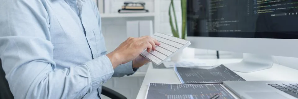 Software development concept, Male programmer using keyboard to typing data c 写真素材