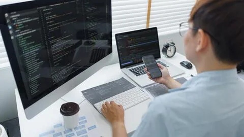 Software development concept, Male programmer check website programming on sm 库存照片
