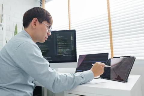 Software development concept, Male programmer point data on tablet to checkin 스톡 사진