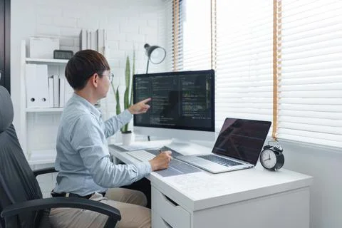 Software development concept, Male programmer checking data codes on document 스톡 사진