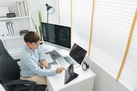 Software development concept, Male programmer point data on tablet to checkin 스톡 사진