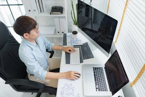 Software development concept, Male programmer typing data code on laptop to d 写真素材