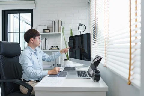 Software development concept, Male programmer checking data codes on document 写真素材