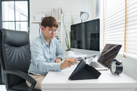 Software development concept, Male programmer point data on tablet to checkin 스톡 사진