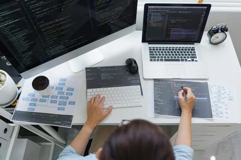 Software development concept, Male programmer pointing on data code to checki 写真素材