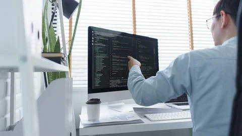 Software development concept, Male programmer checking data codes on document 스톡 사진