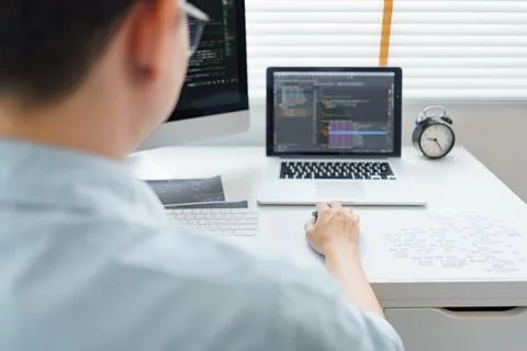 Software development concept, Male programmer typing data code on laptop to.. 写真素材