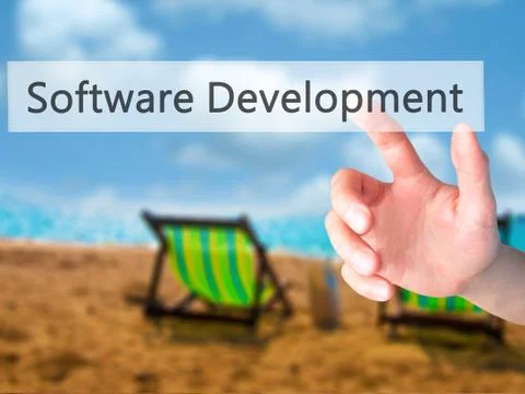 Software Development - Hand pressing a button on blurred background concept . Foto stock