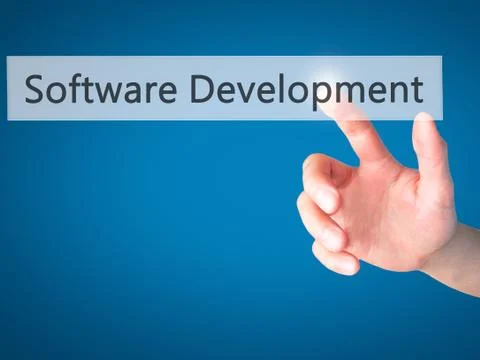 Software Development - Hand pressing a button on blurred background concept . Foto stock
