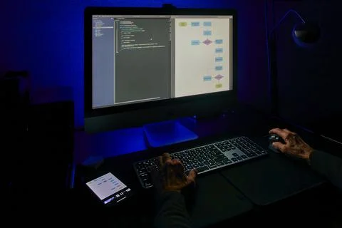 Software Development Process with Code and Flowchart on Screen 写真素材