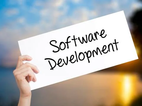 Software Development Sign on white paper. Man Hand Holding Paper with text. I Stock Photos