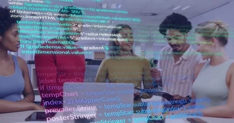 Software development team gathering around laptop and tablet in modern office, Stock Footage 329926989