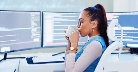 Software development, woman programmer and computer with coffee for system Stockfoto's