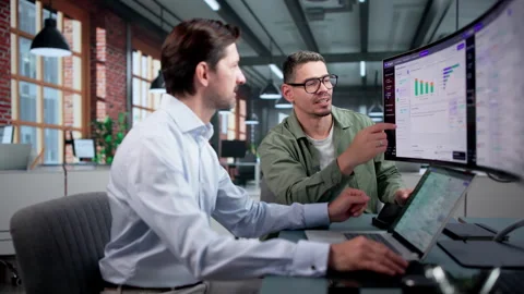 Software Engineer And Colleague Test AI Chatbot Stock Footage 346932097
