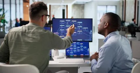 Software Engineer And Programmer Collaborate On Visual Workflow Using Laptop. 写真素材
