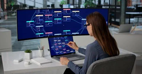 Software Engineer Building Visual Workflow On Laptop For Business Automation  스톡 사진