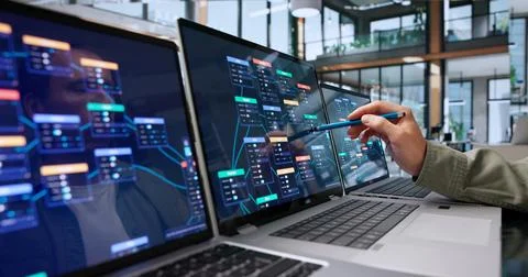 Software Engineer Carefully Designing Efficient Workflows On Laptop In Office Stock Photos
