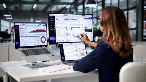 Software Engineer Carefully Monitors AI Workflow On Laptop Stock Footage 347288674