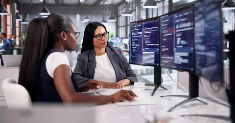 Software Engineer Carefully Writes Agile Code On Computer In Bright Office. Stock-Fotos