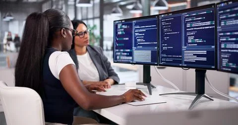 Software Engineer Coding Agile Software Solutions Diligently In Modern Office Stock Photos