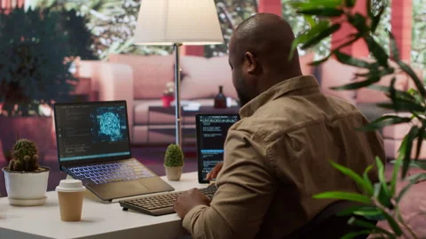 Software engineer coding on a laptop focusing on deep learning Stock Footage 277824406