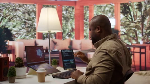 Software engineer coding on a laptop focusing on deep learning Stock Footage 277835232