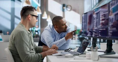 Software Engineer Collaborates With Team To Develop Secure Code. Stock Photos