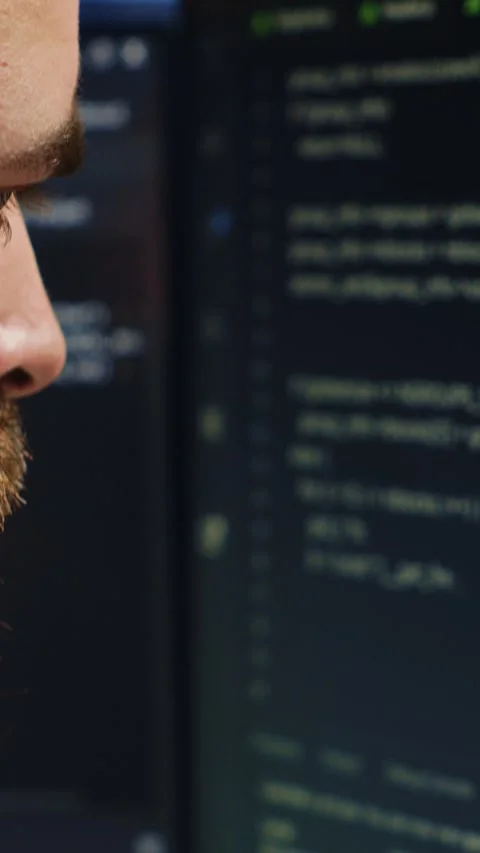 Software engineer concerned, concentrating on finding code bugs, close up Stock Footage 264512147