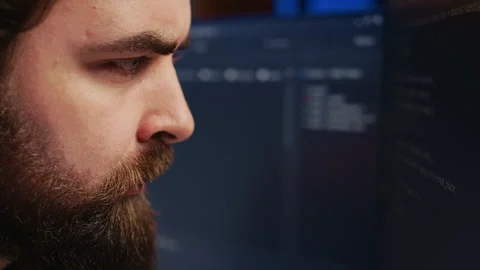 Software engineer concerned, concentrating on finding code bugs, close up Stock Footage 265508967