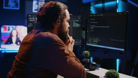 Software engineer concerned, concentrating on finding code bugs, close up Stock Footage 265617501