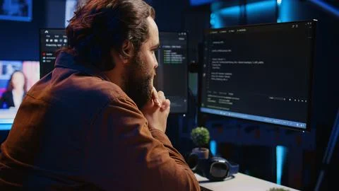 Software engineer concerned, concentrating on finding code bugs, close up Stockfoto's