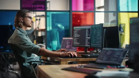 Software Engineer Developing Application In Office Video stock 223191944