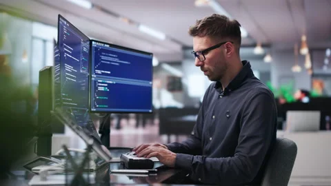 Software Engineer Focuses On Coding Stock Footage 339887216