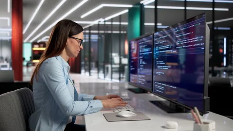 Software Engineer Focuses Intently On Coding Stock Footage 330253986