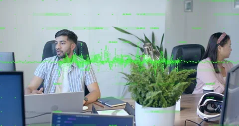 Software engineer glancing toward colleague sharing idea, causing green waveform Stock Footage 314868581