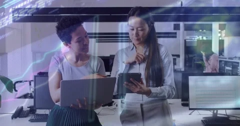 Software engineer handing laptop to manager, reviewing data and swiping tablet Stock Footage 325965014