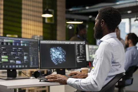 Software engineer leverages AI language model assistance while coding Stock Photos