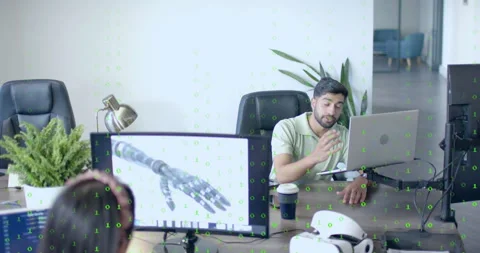 Software engineer listening to colleague, showing code overlay on prosthetic Stock Footage 314868357