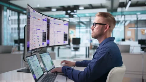 Software Engineer Monitors AI Orchestration Platform Stock Footage 347283397