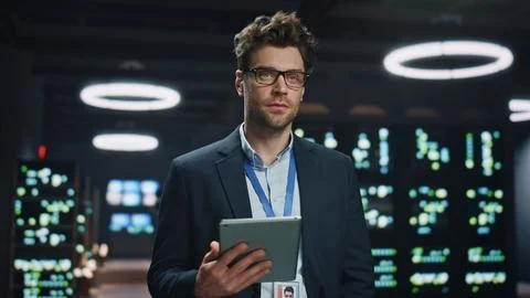 Software engineer posing server room datacenter portrait. Man looking camera 스톡 사진