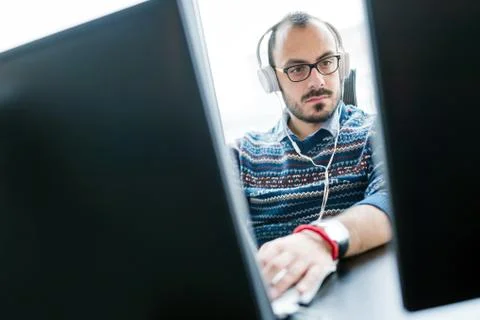 Software engineer programming in office Stock Photos